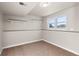 Unfinished basement storage room with shelving and a window at 446 Dione Pl, Lone Tree, CO 80124