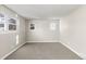 Bright bedroom featuring neutral walls and carpet at 446 Dione Pl, Lone Tree, CO 80124