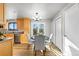 Bright dining area with wood floors and a table for four at 446 Dione Pl, Lone Tree, CO 80124