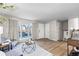 Living room with hardwood floors, stylish seating and entryway view at 446 Dione Pl, Lone Tree, CO 80124