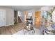 Living room with hardwood floors, stairs, and kitchen view at 446 Dione Pl, Lone Tree, CO 80124