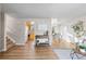 Spacious living room with hardwood floors and view of kitchen at 446 Dione Pl, Lone Tree, CO 80124