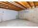 Unfinished basement area with exposed beams and concrete floor at 446 Dione Pl, Lone Tree, CO 80124