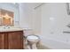 Clean bathroom with a shower/tub combo and wood vanity at 1405 Willow Oak Rd, Castle Rock, CO 80104