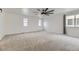 Bright and spacious bedroom with neutral carpeting and ceiling fan at 1405 Willow Oak Rd, Castle Rock, CO 80104