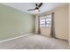 Spacious bedroom with two-toned walls and ceiling fan at 1405 Willow Oak Rd, Castle Rock, CO 80104