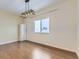 Spacious bedroom with hardwood floors and a large window at 1405 Willow Oak Rd, Castle Rock, CO 80104