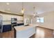 Modern kitchen with white and blue cabinets, quartz countertops, and stainless steel appliances at 1405 Willow Oak Rd, Castle Rock, CO 80104