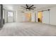 Large main bedroom with carpet flooring and a barn door at 1405 Willow Oak Rd, Castle Rock, CO 80104