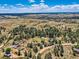 Panoramic aerial view showcasing homes in a wooded, rural community at 1817 Buttercup Rd, Elizabeth, CO 80107