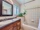 This bathroom features a double sink vanity with tile floors and a shower-tub combination at 1817 Buttercup Rd, Elizabeth, CO 80107