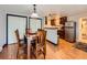 The dining area features a wooden table set with chairs, complemented by wood floors and natural light at 1817 Buttercup Rd, Elizabeth, CO 80107