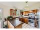 Well-lit kitchen boasting stainless steel appliances at 1817 Buttercup Rd, Elizabeth, CO 80107