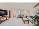 Inviting living room with plush carpet and natural light at 1817 Buttercup Rd, Elizabeth, CO 80107