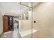 Bright bathroom with large shower with bench, sauna, and tile flooring at 31755 Ponderosa Way, Evergreen, CO 80439