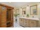 Bathroom boasting a sauna, dual sinks, and ample natural light through the window at 31755 Ponderosa Way, Evergreen, CO 80439