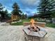 Outdoor fire pit with seating and views of the mountains at 31755 Ponderosa Way, Evergreen, CO 80439