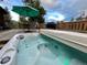 Deck with dining and lounge area, including a spa overlooking mountain views at 31755 Ponderosa Way, Evergreen, CO 80439