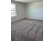 This bedroom is carpeted and features a window with a view at 21996 E 39Th Pl, Aurora, CO 80019