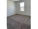 This bedroom is carpeted and features a window with a view at 21996 E 39Th Pl, Aurora, CO 80019