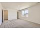 Spacious bedroom with neutral carpet, freshly painted walls, and ample natural light at 21996 E 39Th Pl, Aurora, CO 80019