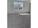 This bedroom is carpeted and features a window with a view of the neighborhood at 21996 E 39Th Pl, Aurora, CO 80019