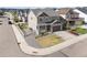 Aerial corner view of a two-story home with a nice yard, fresh landscaping, and a white fence at 2576 Villageview Ln, Castle Rock, CO 80104