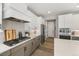 Bright kitchen with gray cabinets, stainless appliances, white countertops, and herringbone backsplash at 2576 Villageview Ln, Castle Rock, CO 80104