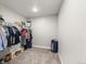 Spacious walk-in closet featuring ample storage and organization with custom shelving for shoes and clothing at 2576 Villageview Ln, Castle Rock, CO 80104