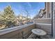 Cozy balcony showcasing an outdoor dining set and neighborhood views at 6845 S Webster St # G, Littleton, CO 80128