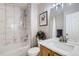 Charming bathroom with marble tile shower, tub and a stylish vanity sink at 6845 S Webster St # G, Littleton, CO 80128