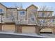 Multi-story townhome featuring brick accents and a convenient garage at 6845 S Webster St # G, Littleton, CO 80128