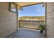 View from balcony features wood railing and exterior siding at 1194 Red Lodge Dr # 201, Evergreen, CO 80439