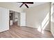 Spacious bedroom with hardwood floors, a ceiling fan, and adjacent dining area at 1194 Red Lodge Dr # 201, Evergreen, CO 80439