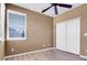 Neutral bedroom featuring a window, closet, and ceiling fan at 1194 Red Lodge Dr # 201, Evergreen, CO 80439