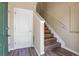 Bright foyer featuring modern flooring, white trim and doors, and easy access to the stairs at 1194 Red Lodge Dr # 201, Evergreen, CO 80439