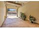Spacious garage with plants and open garage door at 1194 Red Lodge Dr # 201, Evergreen, CO 80439