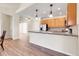 An open floorplan connects the kitchen, dining area, and living room at 1194 Red Lodge Dr # 201, Evergreen, CO 80439