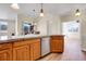 Open kitchen boasts an island with bar seating and stainless steel appliances at 1194 Red Lodge Dr # 201, Evergreen, CO 80439