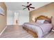 Large main bedroom with a ceiling fan and an ensuite bathroom, offering a private retreat at 1194 Red Lodge Dr # 201, Evergreen, CO 80439
