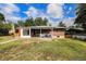 Spacious backyard with a patio area, providing a great outdoor space for relaxation and entertaining at 2939 S Zurich Ct, Denver, CO 80236