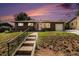 Charming brick home with a well-manicured lawn and inviting front entrance in a residential neighborhood at 2939 S Zurich Ct, Denver, CO 80236