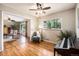 Inviting living spaces with hardwood floors, ceiling fans, and seamlessly connected rooms for easy living at 2939 S Zurich Ct, Denver, CO 80236