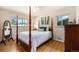 Serene main bedroom with hardwood floors, natural light, and elegant furnishings, offering a peaceful retreat at 2939 S Zurich Ct, Denver, CO 80236
