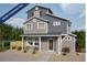 Charming two-story home featuring a covered porch, neutral siding, and well-manicured landscaping at 46513 Sunflower Ln, Bennett, CO 80102