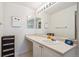 Bathroom featuring vanity with single sink, modern fixtures and mirror at 5302 S Robb Ct, Littleton, CO 80127