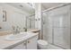 Modern bathroom features a glass-enclosed shower, ample counter space, and updated fixtures at 5302 S Robb Ct, Littleton, CO 80127