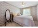 Cozy bedroom with carpet, window, mirror and a ceiling fan at 5302 S Robb Ct, Littleton, CO 80127