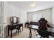 Bedroom with a desk, black leather sofa and large picture window at 5302 S Robb Ct, Littleton, CO 80127