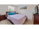 Cozy bedroom with a window for natural light and a dresser for storage at 5302 S Robb Ct, Littleton, CO 80127